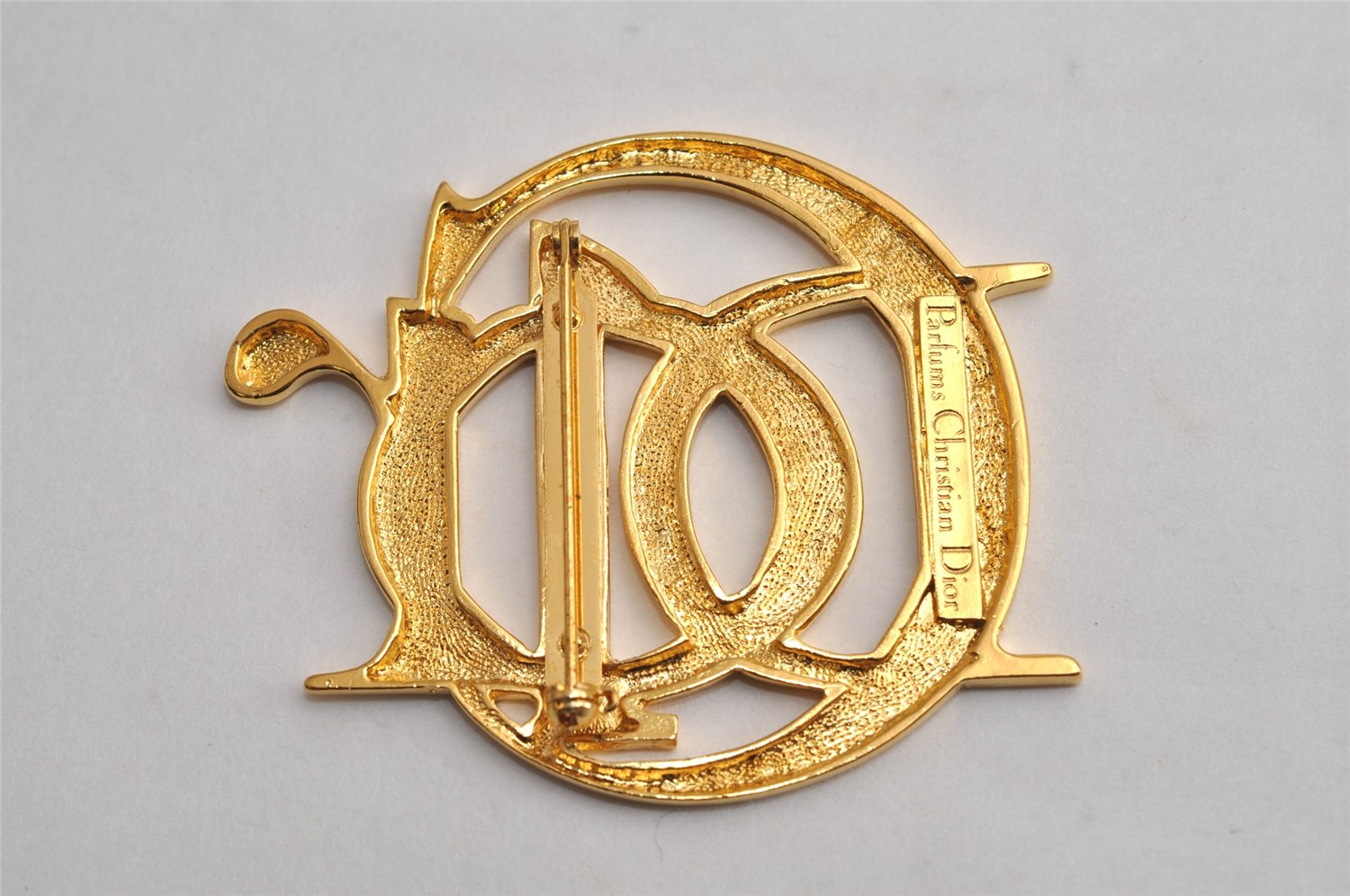 Authentic Christian Dior Vintage Logo Brooch Gold Tone CD 0473K