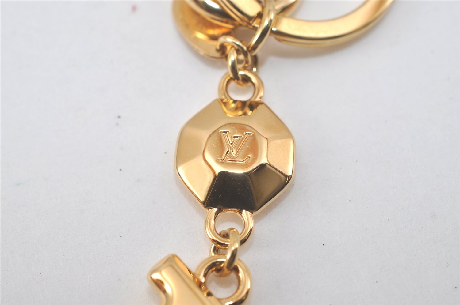 Authentic Louis Vuitton Porte Cles LV Facet Charm Key Ring Gold M65216 Box 1758L