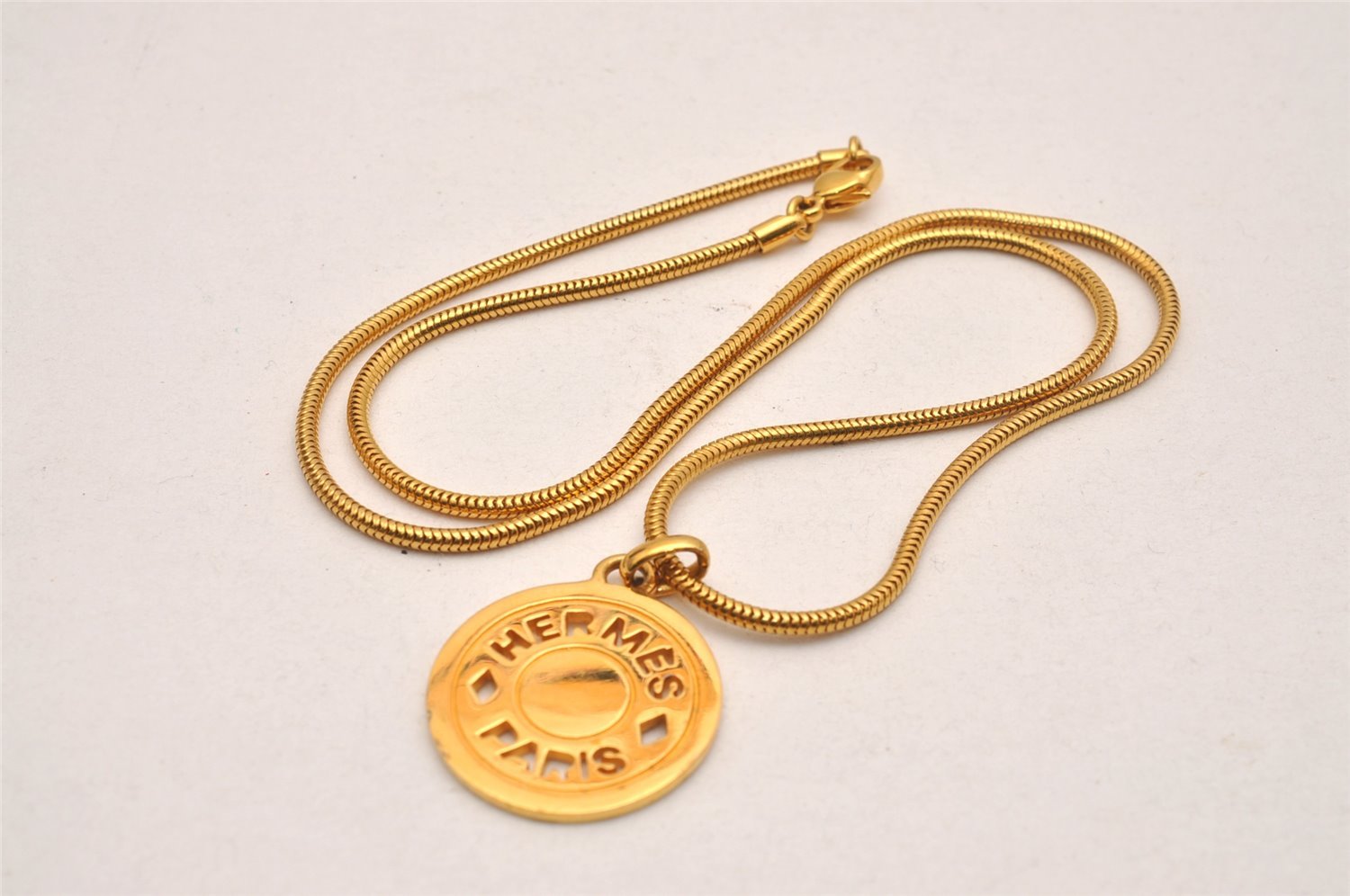 Authentic HERMES Sellier Medallion Gold Tone Pendant Necklace 3694J