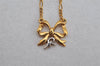 Authentic NINA RICCI Gold Tone Ribbon Shaped Chain Pendant Necklace  8639J