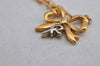 Authentic NINA RICCI Gold Tone Ribbon Shaped Chain Pendant Necklace  8639J